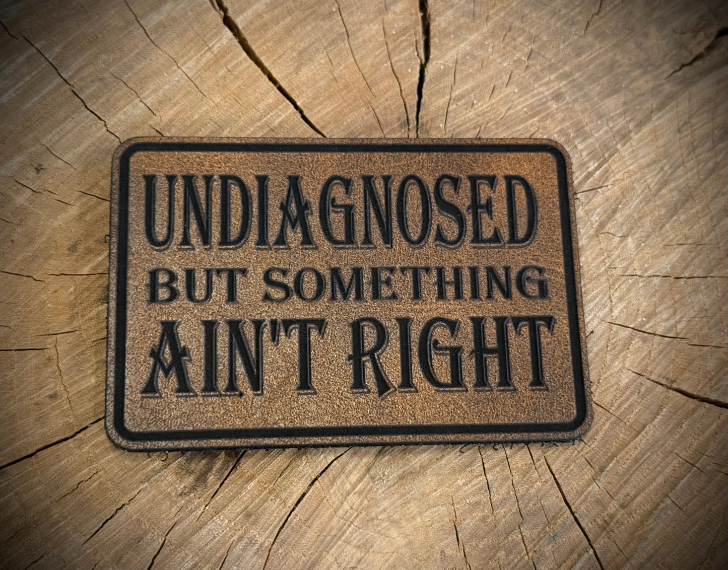 Undiagnosed But Something Ain’t Right Leatherette Morale Patch – Velcro-Backed Mystery Malady
